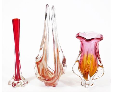 A Bohemian art glass vase, in pink, orange and clear forms, 23cm high, and two others. (3)