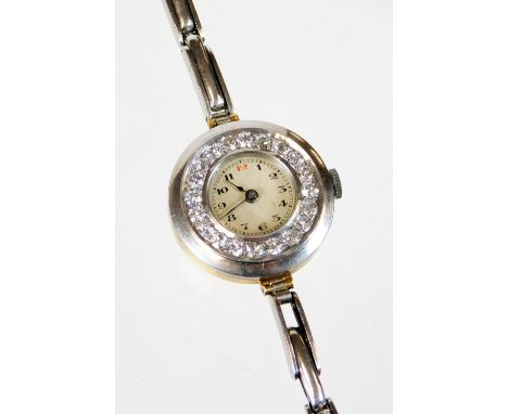 A 1920's/30's diamond set cocktail watch, on a later bracelet, the watch head with small cream coloured dial, surrounded by n