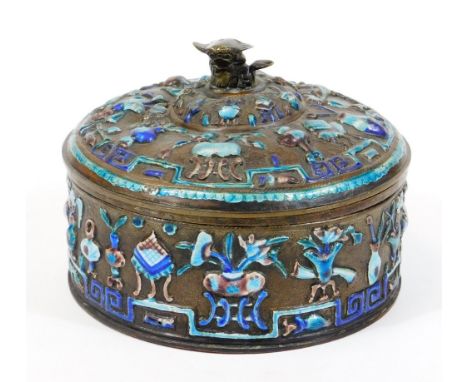 A Chinese enamel on copper box and cover, of circular form, heavily decorated with raised flowers in blue and turquoise on a 