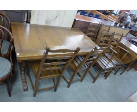 An Ercol draw-leaf dining table and six chairs