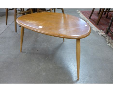 An Ercol pebble shaped occasional table