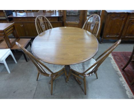 An Ercol dining table and four chairs