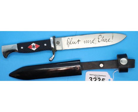 Third Reich replica Hitler Youth dagger with enamelled emblem set into the chequered grip, steel scabbard and leather frog, b