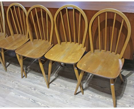 A set of four Ercol blonde elm and beech chairs.&nbsp;Condition - general wear throughout including scuffs, scratches etc., g