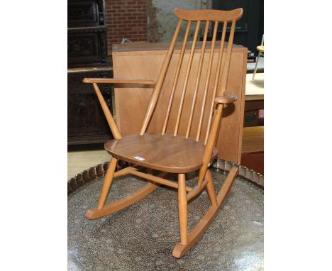 An Ercol light elm and beech rocking chair.  