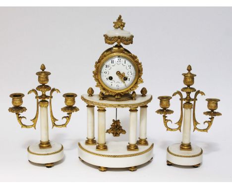 A French late 19th century marble and ormolu clock garniture, height 40cm.Condition:- General wear through age and use, winds
