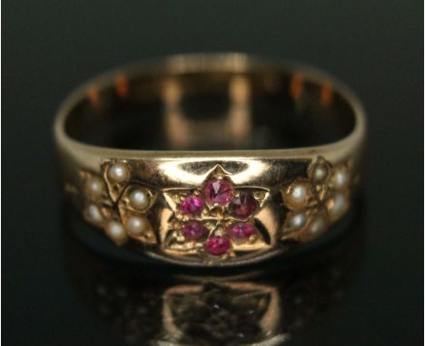 A Victorian hallmarked 15ct gold pearl and ruby ring, gross wt. 2g, size O.  Condition - evidence of re-sizing, marks partial