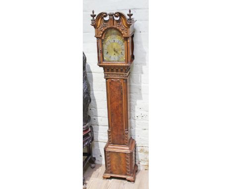 A good quality miniature long case clock, three train movement striking on eight gongs, brass and steel dial, hood with swan 