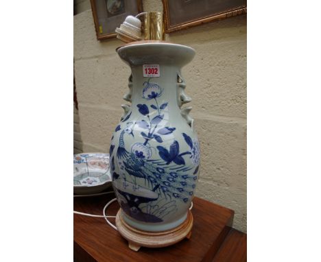 A Chinese celadon ground twin handled vase, mounted as a lamp, the vase 36cm high; together with a Japanese barber's bowl, (a