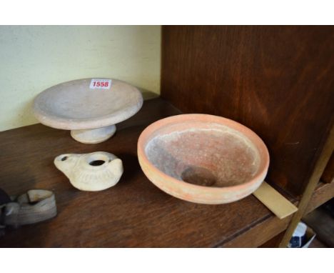 Antiquities: a Roman oil lamp; together with another circular bowl, circa 3rd century AD; 14cm diameter, and a Greek pedestal