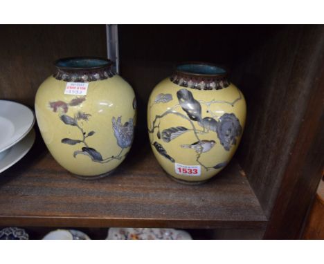 A pair of Japanese cloisonne enamel ovoid vases, 15cm high, (one a.f.)  