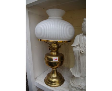 A brass oil lamp. 