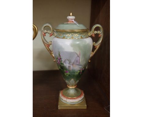 A Royal Worcester twin handled pedestal vase and cover, circa 1903, painted with a cottage garden, by H. Davis, signed, shape