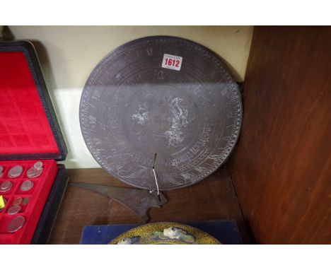 A brass sundial, 29cm diameter.