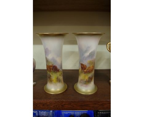 A pair of Royal Worcester flared vases, circa 1917, painted with Highland cattle, by H. Stinton, signed, shape G923, 23cm hig