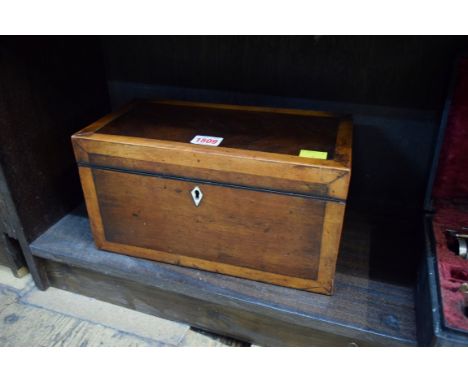 A George III mahogany and satinwood banded tea caddy, 30.5cm wide.