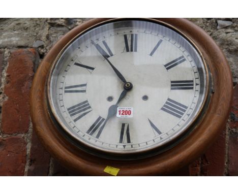 An Ansonia oak circular wall clock, 40.5cm diameter. 