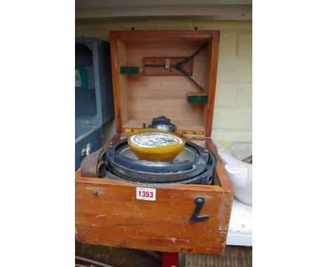 An old ship's compass, in stained pine box. 