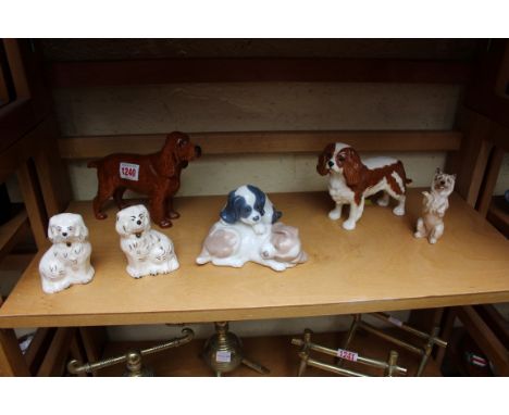 A Beswick Champion Horseshoe Primula cocker spaniel; together with a Beswick King Charles spaniels, a Nao figure group of two