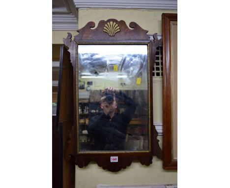An antique mahogany and parcel gilt fret framed wall mirror, 65 x 41.5cm. 