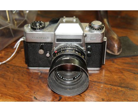 Cameras: a Leicaflex SL, chrome, No.1197481, with Summicron-R 1:2/50 lens, No.2666532.