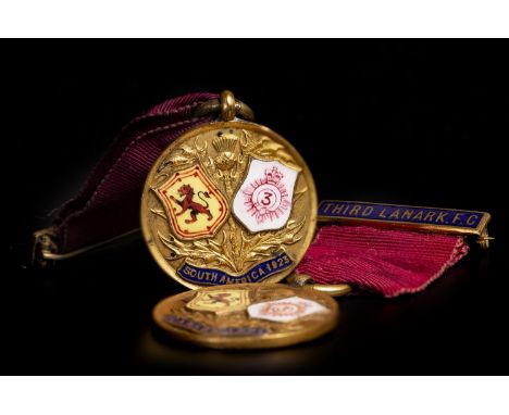 TWO EARLY 20TH CENTURY THIRD LANARK F.C. MEDALS, the obverse of each gilt medal with thistle and enamelled shield motif decor