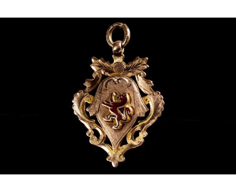 1906 GOLD FOOTBALL MEDAL, the obverse with red enamel lion rampant in relief, the reverse with 'B &amp; D. J. F. A. Won by Ja