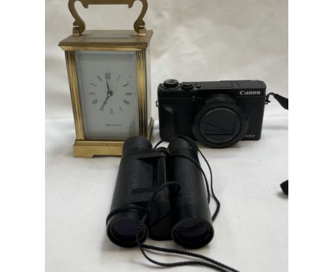 A Mappin and Webb brass cased carriage clock together with a Canon G5X camera and folding binoculars