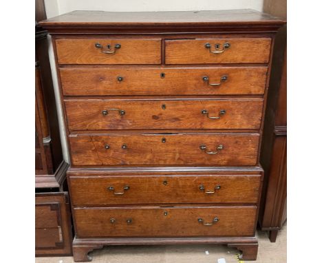 A 19th century oak chest on chest, with a moulded cornice above two short and three long drawers, the base with two long draw