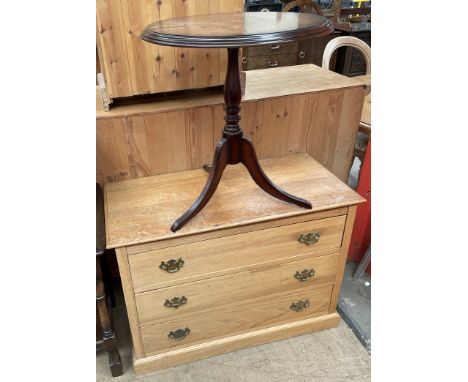 A modern oak chest with three long drawers on a plinth together with a modern tripod table