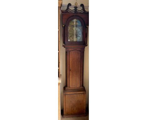 A 19th century mahogany longcase clock, the hood with a broken swan neck pediment and ionic columns, above a long trunk door 