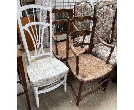 A pair of ladder back chairs with rush seats together with a white painted bedroom chair