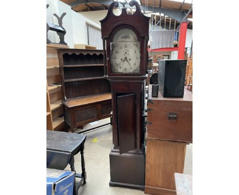 A 19th century mahogany longcase clock, the hood with a broken swan neck pediment and fluted columns above a long trunk door,