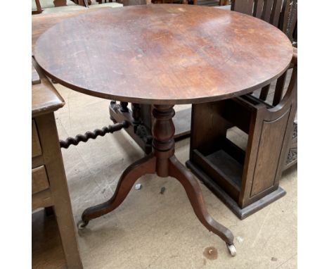 A 19th century mahogany tripod table, with a turned column on a tripod base