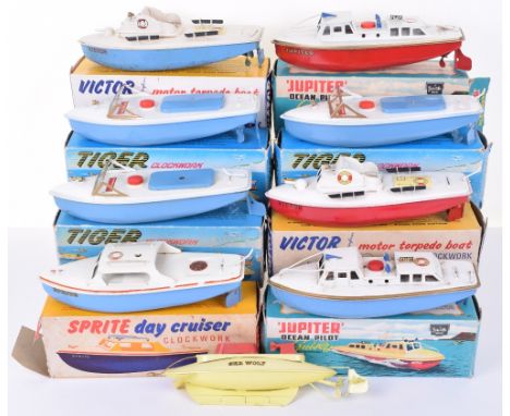 Nine Sutcliffe Clockwork Boats, 2 x boxed Jupiter Ocean pilot cruiser’s, red/white, blue/white, both missing masts,  3 x boxe