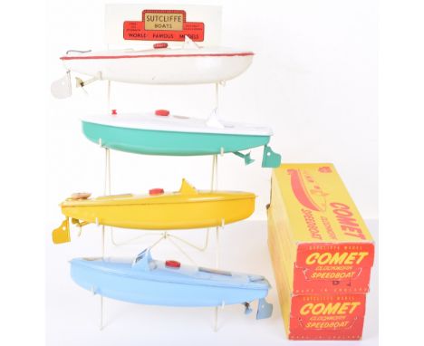 A Sutcliffe Boats Shop Retailers Wire Display Stand complete with four Sutcliffe boats, two boxed Comet clockwork speedboats,