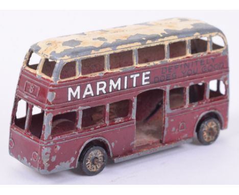 Dinky (pre-war) 29 Motor bus, maroon with cream roof, silver and black Marmite adverts, fair condition, some paint loss mainl