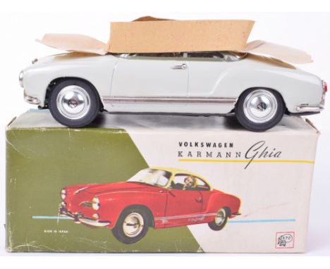 A boxed Asahi tinplate friction driven Volkswagen Karmann Ghia, Japanese circa 1960, finished in light green with green roof,