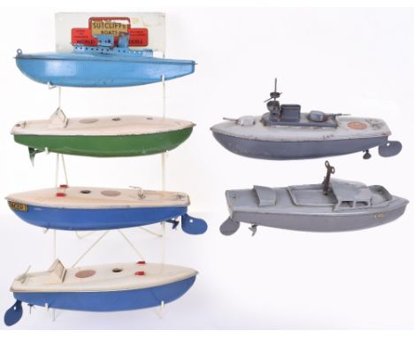 A Sutcliffe Boats Shop Retailers Wire Display Stand, complete with Five Pre/Post War Sutcliffe boats, rare 9inch pull along b