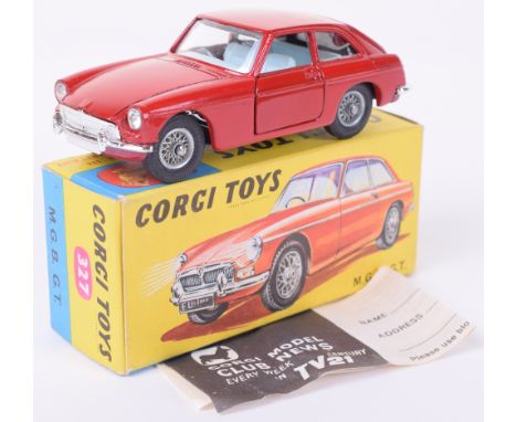 Corgi Toys 327 M.G.B G.T. red body, light blue interior, spoked wheel hubs, with suitcase, in near mint original condition, C