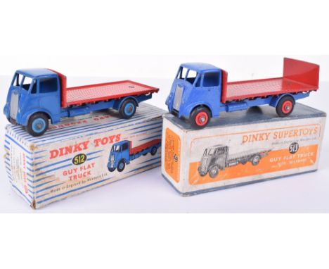 Dinky two boxed Guy trucks, 512 Guy Flat truck 1st type dark blue cab and chassis, red flatbed and mid-blue ridged hubs, gene