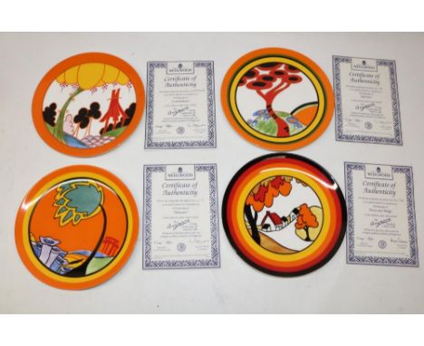 Four Wedgwood Clarice Cliff Bradford Exchange wall plates, patterns comprising 'House and Bridge', 'Monsoon', 'Red Tree', and