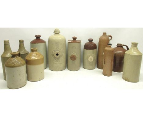 Collection of four early 20th century ceramic foot warmers, three stoneware flagons and five large stoneware bottles 