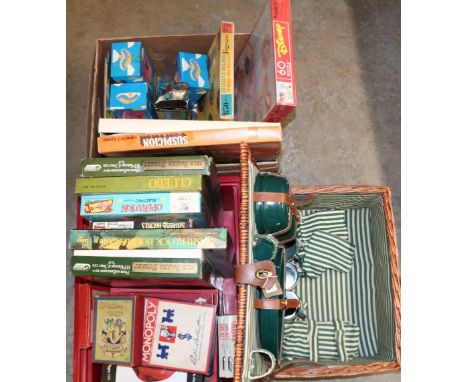 Collection of vintage board games in two boxes, Teletubbies vinyl figures, and a wicker picnic hamper and contents 
