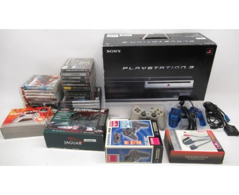 Boxed Playstation 3 games console with four controllers incl, Jaguar racing controller, ten PS3 games, five PS2 games and nin