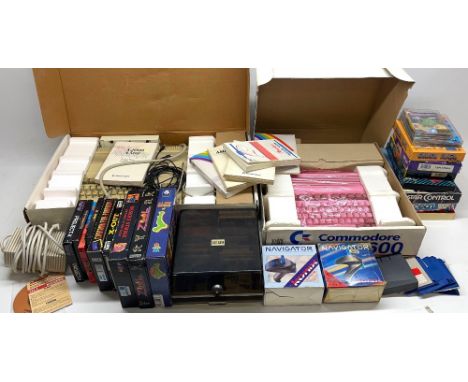 Two boxed Commodore Amiga computer systems including model 500 and 600, two navigator controllers, large quantity of floppy d