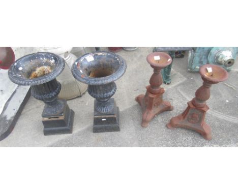 Small pair of cast iron urns on plinths. Height 50cm. Pair of cast iron ornate tee-light / candle sticks, on three legs, unus