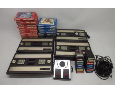 Four Mattel IntelliVision games consoles, with twenty-four boxed games incl night stalker, space armada, advanced dungeons &a