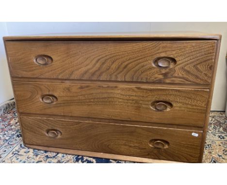 Ercol Windsor model 412  elm chest, rectangular top over three drawers, lacking castors, W91cm D47cm H60cm 