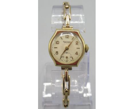 Ladies Rotary 9ct gold wristwatch on Britannic 9ct rolled gold expanding bracelet, signed linen weave textured parchment dial